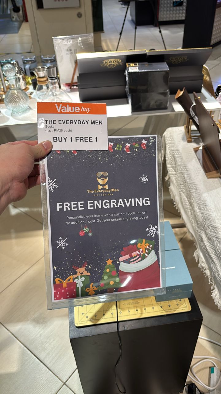 Free engraving signage in a transparent acrylic holder on the booth